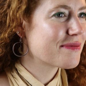 Jennifer Kahn Jewelry small sterling silver hoop earrings with brass moons.